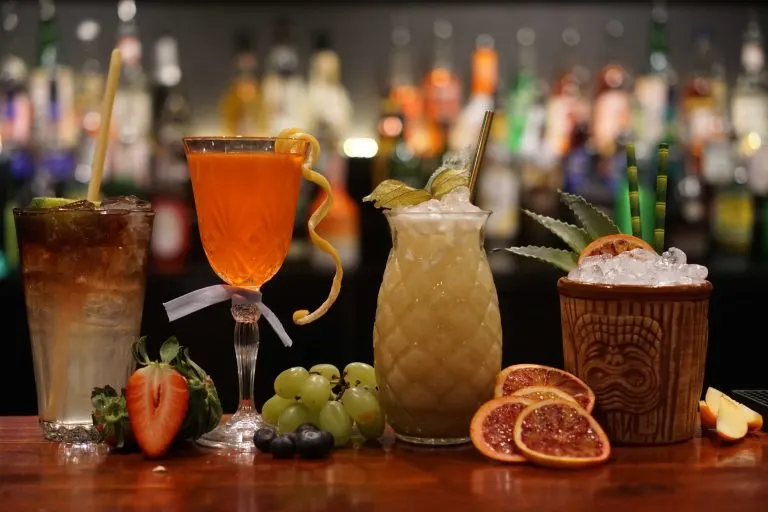 Colorful cocktails on a fruit bar