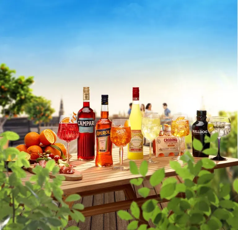 Aperol, Campari and other spritz aperitifs on a sunny terrace